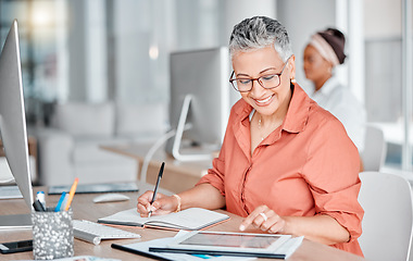 Image showing Book, tablet and business woman writing, research or internet browsing in office workplace. Technology, notebook and senior female employee with touchscreen for taking notes and planning strategy.