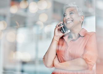 Image showing Business, smile and senior woman on a phone call for discussion, client networking and connection by window. Communication, meeting and female ceo speaking, talking and in conversation on smartphone