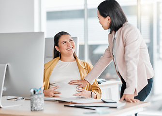 Image showing Pregnancy, friends touch and office workplace by computer with colleague, smile and talking with future mom. Pregnant woman, desk and happy chat for support in career for women, abdomen and desktop