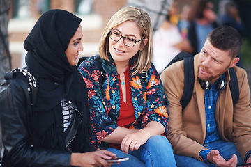 Image showing Friends, diversity and happy people with communication and connection outdoor on stairs. Hijab, muslim and talking women and adult learning and international student community on college steps