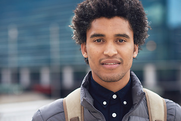 Image showing Black man, city portrait and with backpack for travel, studying and focus by blurred background. Young gen z student, outdoor adventure and happy in metro with goals, vision and dream by buildings