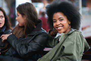 Image showing Black woman, portrait and friends outdoor with communication on a urban bench. Happiness, women group and conversation of a young person with a happy smile feeling relax with blurred background