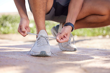 Image showing Fitness, running and man tie shoes ready to start exercise, marathon training and endurance workout. Sports, nature trail and feet of male runner tying shoelace for wellness, health and performance