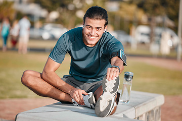 Image showing Fitness, portrait and man doing a stretching exercise before running or training for a marathon in a park. Sports, health and male athlete doing leg warm up before an outdoor cardio workout in field.