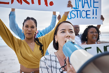 Image showing Climate change protest, megaphone and Asian woman with crowd at beach protesting for environment, global warming and to stop pollution. Save the earth, activism and female leader shouting on bullhorn