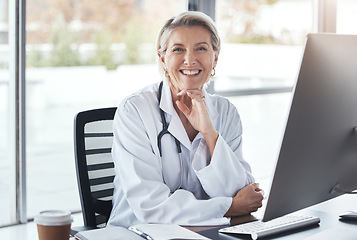 Image showing Healthcare, consultant and portrait of a doctor in office for medical work, cardiology and surgery. Happy, working and mature woman consulting in medicine, hospital research and expert consultation