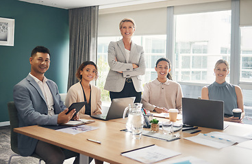 Image showing Portrait of employees at desk in office with smile, confidence and meeting for group of business people. Teamwork, about us and leadership, senior lawyer with happy legal team at advisory law firm.
