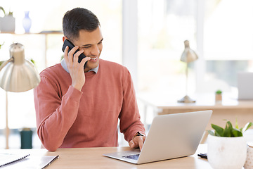 Image showing Businessman, phone call and laptop with smile for communication, conversation or discussion at office desk. Happy male employee working on computer and talking on smartphone for planning strategy