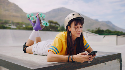 Image showing Social media, chat and woman on a phone while rollerskating for communication and connection in park. Digital, internet and girl reading a message on a mobile app while at a park to skate for sports