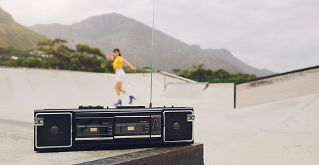 Image showing Music, park and woman rollerskating with a stereo for fitness, training and learning in Norway. Freedom, practice and girl skating for exercise with a radio for motivation, fun and skate cardio