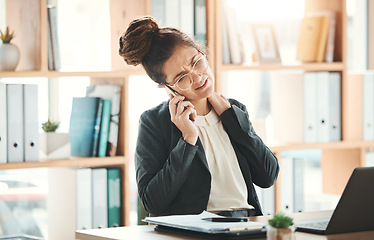 Image showing Phone call, office and business woman with neck pain, injury or accident on a telehealth consultation. Corporate, professional and female employee with a back muscle sprain working in the workplace.