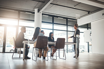 Image showing Businesswoman, coaching and meeting in conference for idea or leadership at office workshop. Female leader, coach or mentor speaking in staff training for marketing, planning or corporate strategy