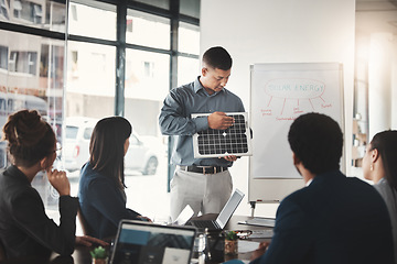 Image showing Man, solar panel and business presentation in office with investor group, ideas or future of earth. Businessman, renewable energy proposal or sustainability at workshop, brainstorming and development