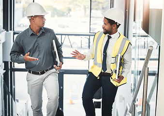 Image showing Engineer, architect and team talking and planning construction for project management. Diversity men together on office stairs for collaboration strategy on engineering, architecture and vision plan