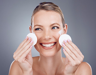 Image showing Skincare, cotton pad and face of woman on gray background for wellness, cosmetics and facial treatment. Beauty, dermatology and happy girl with patches for makeup removal, spa products and cleaning