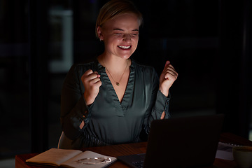 Image showing Night, laptop and woman with achievement, excited and happiness for business deal, sales growth and promotion. Dark, female employee and entrepreneur with device, smile and celebration for good news