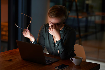 Image showing Tired, dark and woman with a headache, laptop and burnout from work stress in the office. Business, migraine and employee with pain from reading an email at night, overtime problem and anxiety