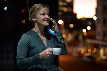 Image showing Coffee, phone call and woman working late night at office, crm and b2b networking in conversation. Technology, communication and happy businesswoman talking on smartphone with smile at overtime work.