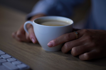 Image showing Woman hands, tea and night computer work of a female freelancer at home with hot drink. House, technology and cup with coffee or cappuccino by a desk with a young person doing remote working