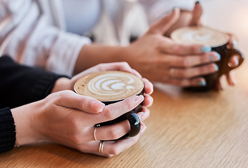 Image showing Coffee, morning and hands of people with cups at a cafe for bonding, breakfast and conversation. Restaurant, relax and friends drinking a latte, warm beverage or drink from a mug at a diner together