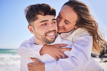 Image showing Love, piggyback and happy couple at the beach on date for romance, valentines day or anniversary. Romantic, happiness and young man and woman having fun together by the ocean on holiday in Australia.