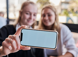 Image showing Selfie, showing and friends with mockup phone for advertising a brand at a restaurant. Marketing, contact and hands of women with a blank mobile screen for a photo, show app and social media at cafe