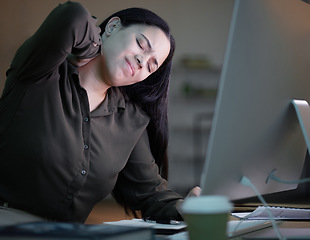 Image showing Woman with neck pain, working at night in office with computer and mental health of corporate business worker. Young overworked person at desk, backache from late workload and employee burnout