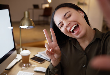 Image showing Night, selfie and peace sign with woman in office for social media, internet and smile. Designer, website and technology with employee and working overtime for networking app, vision and blog picture