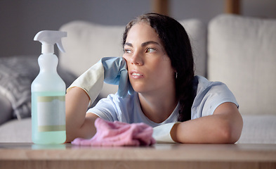 Image showing Spray bottle, tired and woman in lounge, thinking and cloth with depression, stress and overworked. Female cleaner, maid and lady in living room, disinfectant and spring cleaning home, rag or burnout