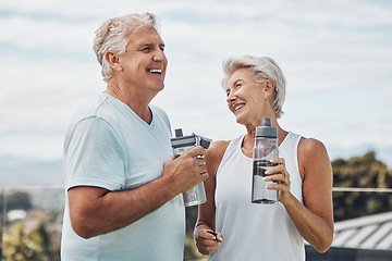 Image showing Senior couple, fitness and water bottle with smile for hydration or thirst after workout, exercise or training in nature. Happy elderly man and woman smiling for natural refreshment from exercising