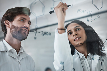 Image showing Teamwork, science and chemistry with people writing in laboratory for medicine, pharmacy or healthcare. Research, analytics and medical with scientists solving on glass board for idea, study or data