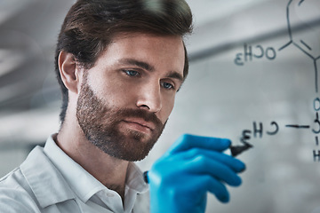 Image showing Serious, science and chemistry with man writing in laboratory for medicine, pharmacy and healthcare. Research, analytics and medical with expert solving on glass board for idea, study and data