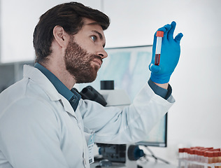 Image showing Science, dna and sample with a doctor man at work in a laboratory for analysis or research. Medical, innovation and blood with a male scientist working in a lab for development or breakthrough