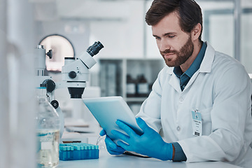 Image showing Science, medical research and man with tablet in laboratory checking results, internet or email online. Healthcare, medicine and innovation in vaccine manufacturing, scientist reading journal website