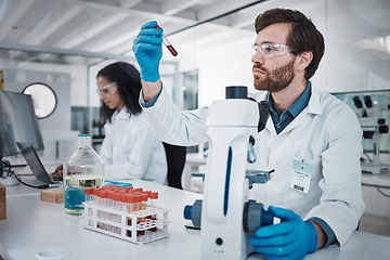 Image showing Thinking, scientist or laboratory microscope of blood sample, test tube research or medical vaccine study. Black woman, man or teamwork in healthcare science, dna engineering or pharmacy innovation