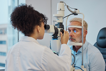 Image showing Vision, eye exam and healthcare with a doctor woman or optometrist testing the eyes of a man patient in a clinic. Hospital, medical or consulting with a female eyesight specialist and senior male