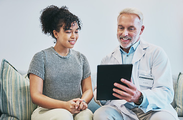 Image showing Doctor, patient and man with tablet for consultation, checkup or health results in home visit. Healthcare, technology and senior medical professional with happy black woman for wellness appointment.