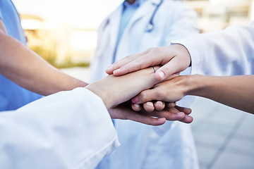 Image showing Healthcare, solidarity and hands of doctors for support, partnership and medical success. Teamwork, trust and team of employees in medicine with a gesture for motivation, commitment and goal