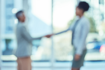 Image showing B2b Handshake, business deal or senior manager consulting or talking to a black woman in office building. Partnership, blurred or successful people shaking hands for contract, thank you or agreement