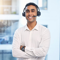 Image showing Call center, smile with portrait of man in office for customer support, telemarketing and communications. Consulting, happy and sales with employee and arms crossed for help desk, advisory and crm