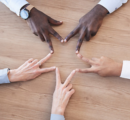 Image showing Hands, star and teamwork overhead with a business team in the office sitting at a boardroom table. Hand sign, shape or collaboration with a man and woman employee group meeting for strategy at work