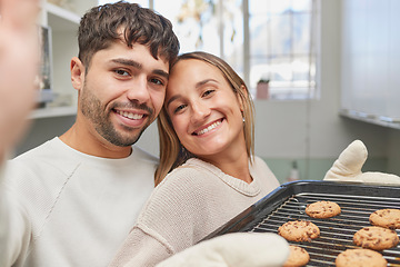 Image showing Kitchen, selfie and couple baking cookies together for love, bonding and romance at home. Bake, smile and portrait happy man and woman preparing biscuits or snacks for fun, event or dessert at house.