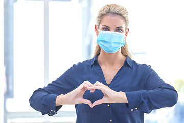 Image showing Business, heart and portrait of a woman with covid, care and emoji for a pandemic at work. Healthcare, safety and corporate employee with a love hand gesture while wearing a face mask during corona