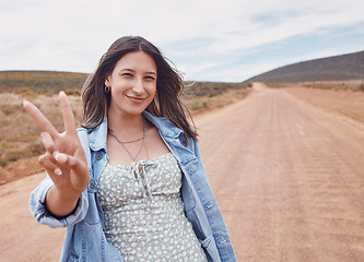 Image showing Travel, portrait and woman on safari with peace sign, outdoor on adventure in Kenya, holiday and summer road trip. Mockup space, happy and journey with freedom, lifestyle and fun in nature with hand