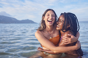 Image showing Funny, ocean and happy with friends swimming at beach for relax, summer break and vacation with blue sky mockup. Travel, bonding and diversity with women for peace, nature and tropical holiday