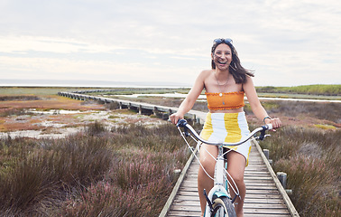 Image showing Portrait, bike and mockup with a woman cycling outdoor in nature for freedom, fun or adventure in the countryside. Happy, smile and bicycle with a female cyclist outside in the wilderness for travel