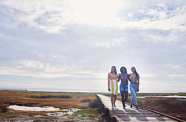 Image showing Travel, freedom and friends walking while on vacation, adventure or outdoor journey in nature. Summer, bonding and women on a walk while on holiday or weekend trip with sky and mockup in countryside.