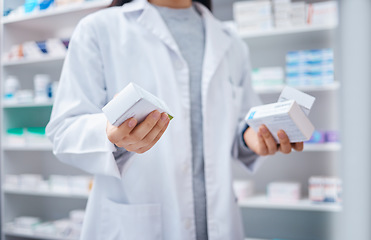 Image showing Pharmacist, pills and medicine with hands of woman in store for healthcare, wellness and retail. Closeup of medical products, pharmacy shopping and boxes of supplements, tablets and package stock