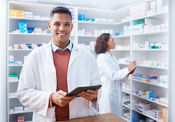 Image showing Tablet, man and portrait of pharmacist in pharmacy for healthcare stock or online consultation. Medication research, telehealth technology and happy male medical doctor with touchscreen in drugstore.