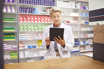 Image showing Tablet, pharmacy and pharmacist woman for product management, stock research and inventory data app. Digital technology, retail logistics and senior healthcare doctor or person with medicine software